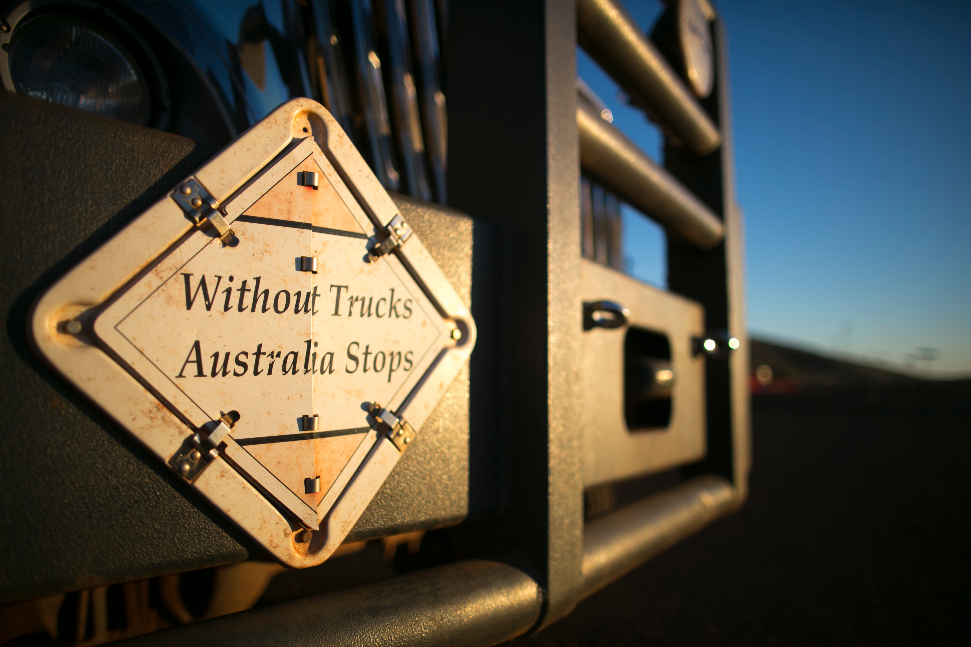 back of a truck with a without trucks Australia stops sign